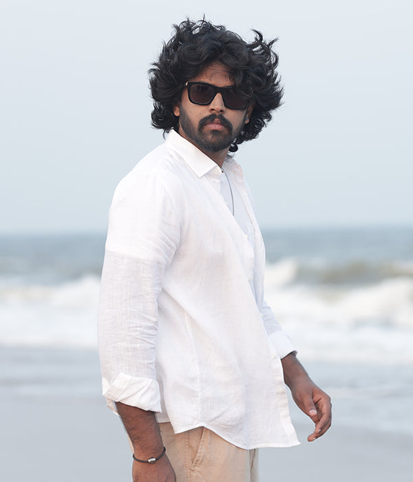 Man wearing a LinenRaj white European linen shirt with softly blurred background