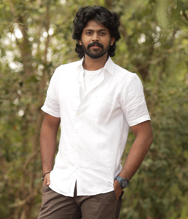 White European linen shirt styled with brown trousers